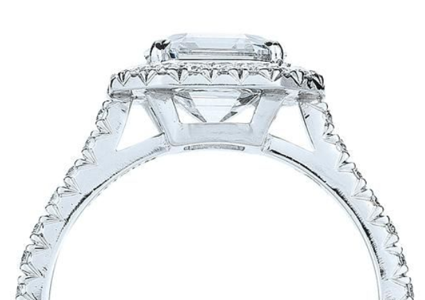 Gallery rail around diamond and side view of prongs of a Kwiat engagement ring